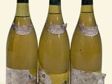 three bottles of wine sitting next to each other on a table