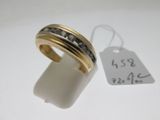 an image of a gold ring with black diamonds and a price tag