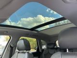 a view of a skylight in the back of a car
