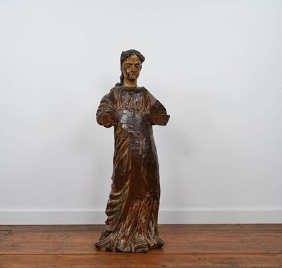 an image of a statue of a woman standing on a wooden floor