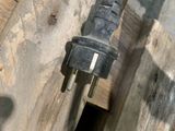 a close up view of a water hose attached to a wooden structure