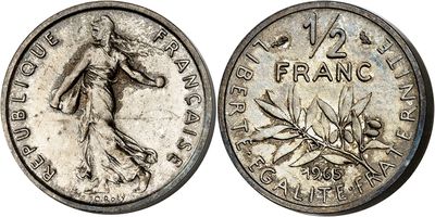 a silver coin with the image of a woman in a dress