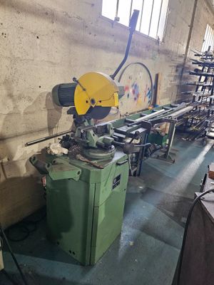 a machine that is sitting in a room with a lot of tools