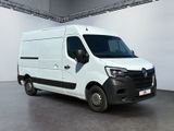 the white van is parked in a large room with white walls