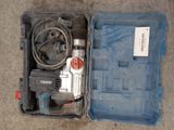 a tool in the case that is sitting on the floor
