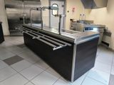 a large kitchen with stainless steel appliances in it