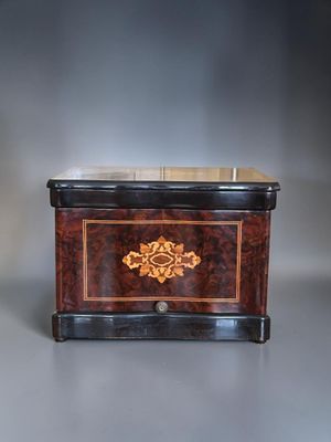 an image of a small wooden box sitting on top of a table