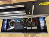 a drawer that has a bunch of tools in it
