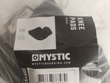 a plastic bag with a pair of black shoes in it
