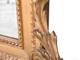 a picture of a gold frame with a mirror in it
