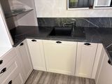 a black and white marble counter top in a kitchen
