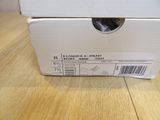 a cat that is sitting in a box on the floor