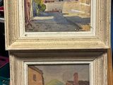 painting of a street scene with buildings and a man walking down the street