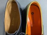 pair of men ' s leather shoes with laces on the soles