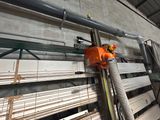 a machine that is working on a piece of wood