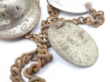 a chain with a coin on it that is attached to a chain