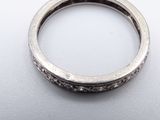 an image of a close up of a ring on a white surface