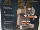 the box of the coffee machine is open and ready to be used