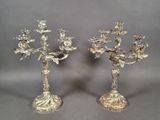 pair of silver plated candlesticks with flowers and leaves