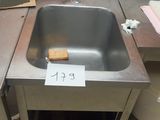 a stainless steel sink in a commercial kitchen