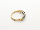 an image of a gold and silver ring on a white surface