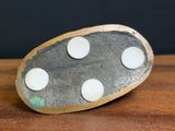 a rock with white dots on it sitting on a table