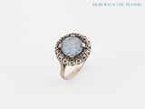 a close up of a ring with a stone in it