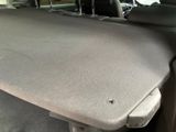 the back seat of a car with a seat cushion on the back of it