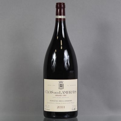 a bottle of red wine sitting on top of a table