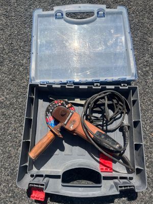 a tool box with tools in it on the ground