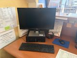 a desktop computer sitting on a desk with a keyboard and mouse
