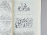 an open book with a picture of a man in a kitchen