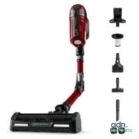 a close up of a cordless vacuum cleaner with a red handle