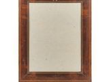 a small wooden frame with a star on it