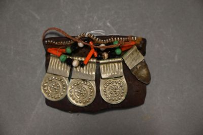 a small purse that has a bunch of coins on it