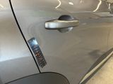 a close up of a car door handle with a sticker on it
