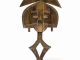 an image of a bronze sculpture of a bird on a wooden base