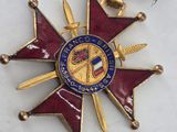 an image of a medal with a ribbon around it on a table