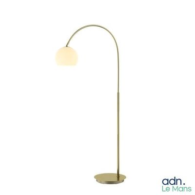 the floor lamp has a metal base and a glass shade
