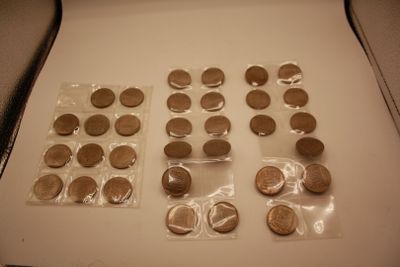 a lot of coins that are on the table
