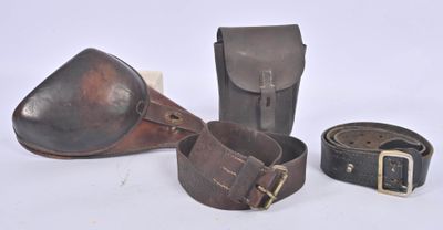 three pieces of leather are sitting next to each other on a white surface