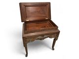 a small wooden box sitting on top of a small table