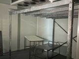 an image of a room with a table and a ceiling fan
