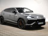 the lamb urus suv is parked in a showroom with a checkered floor