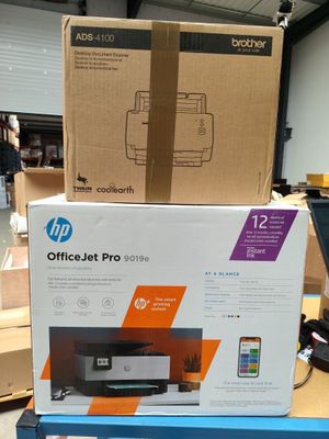 boxes of officejet pro printers are stacked on top of each other