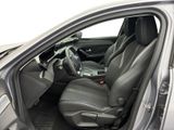 the interior of a car with the door open and the driver ' s seat down