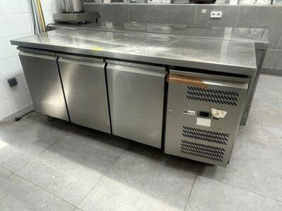 a stainless steel counter in a commercial kitchen