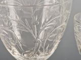 two wine glasses sitting next to each other on a table