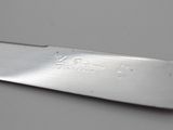 a knife that is laying on a table