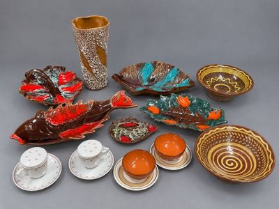 many different types of dishes and cups on the table